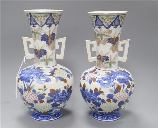 A pair of Japanese porcelain two handled vases H.28cm